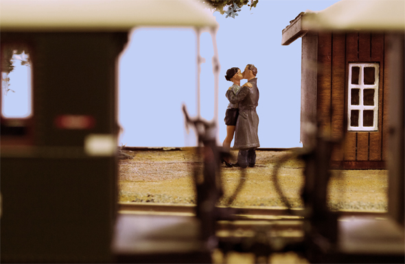 couple kissing on a gauge 1 layout